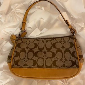 Small tan and brown embroidered Coach bag